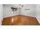 Spacious bedroom features hardwood floors, neutral walls, and a ceiling fan at 4405 Turnberry Cir, Durham, NC 27712