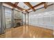 Cozy living room with a stone fireplace, hardwood floors, and built-in shelves at 4405 Turnberry Cir, Durham, NC 27712