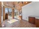 Covered porch features outdoor kitchen, ceiling fans and stone tile floors at 4405 Turnberry Cir, Durham, NC 27712