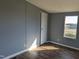 This bedroom features beautiful vinyl floors, neutral paint, a closet, and plenty of natural light at 4600 Strawbush Rd, Spring Hope, NC 27882