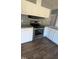 Updated kitchen with stainless steel appliances, granite countertops, and white cabinetry at 4600 Strawbush Rd, Spring Hope, NC 27882