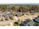 Picturesque neighborhood featuring mature trees, and lush landscaping, with an inviting in-ground pool and outdoor entertaining area at 4773 Swordfish Dr, Raleigh, NC 27603