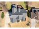 Overhead of home with dark roof and back deck surrounded by green grass and trees at 4773 Swordfish Dr, Raleigh, NC 27603