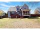 Spacious backyard featuring a patio, deck, and lush green lawn, perfect for outdoor activities at 4773 Swordfish Dr, Raleigh, NC 27603
