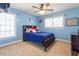 Bright bedroom featuring a large window and carpeted floors at 4773 Swordfish Dr, Raleigh, NC 27603