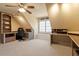 Spacious bonus room featuring multiple workspaces, built-in shelving, and neutral carpeting at 4773 Swordfish Dr, Raleigh, NC 27603