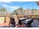 Cozy outdoor deck with a seating area, string lights and a firepit, perfect for entertaining at 4773 Swordfish Dr, Raleigh, NC 27603