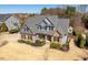 Inviting two-story home featuring a mix of stone and siding, complemented by a well-maintained lawn and tasteful landscaping at 4773 Swordfish Dr, Raleigh, NC 27603