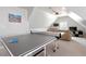 Bright game room with a ping pong table, large wall art, and a comfortable seating area at 4773 Swordfish Dr, Raleigh, NC 27603