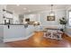 Eat-in kitchen featuring a breakfast bar, dining area, stainless steel appliances and bright white cabinets at 4773 Swordfish Dr, Raleigh, NC 27603