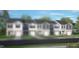 New two-story townhome with attached garage, grey horizontal siding and black shutters at 50 Sweet Meadow Rd, Angier, NC 27501