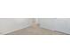 Hallway featuring beige carpeting, white walls, doors, and baseboards at 50 Sweet Meadow Rd, Angier, NC 27501