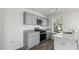 Kitchen boasts stainless steel appliances, modern grey cabinetry and a granite countertop at 50 Sweet Meadow Rd, Angier, NC 27501