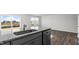 Kitchen with granite countertops and stainless-steel appliances with open concept to the living room at 50 Sweet Meadow Rd, Angier, NC 27501