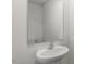 Modern powder room with a pedestal sink and large frameless mirror at 50 Sweet Meadow Rd, Angier, NC 27501
