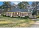 Spacious home showing a side patio, featuring a brick exterior and a well-maintained lawn at 5013 Kristie Ln, Nashville, NC 27856