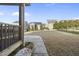 Landscaped backyard with a patio and view of neighboring houses on a sunny day at 504 Copper Beech Ln, Wake Forest, NC 27587