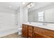 This bathroom has a double sink vanity and tub with shower at 509 Horseman Park Pl, Wendell, NC 27591