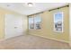 This is a bright bedroom with many windows at 509 Horseman Park Pl, Wendell, NC 27591