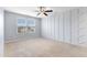 This bedroom has a large window and a modern ceiling fan at 509 Horseman Park Pl, Wendell, NC 27591
