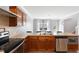 Spacious kitchen featuring stainless steel appliances, wood cabinets, and ample counter space at 509 Horseman Park Pl, Wendell, NC 27591