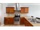 Well-equipped kitchen with stainless steel appliances, ample counter space, and wooden cabinets at 509 Horseman Park Pl, Wendell, NC 27591