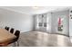 Open-concept living area with wood floors and access to an outdoor seating area at 509 Horseman Park Pl, Wendell, NC 27591