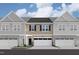 Charming townhome featuring a private garage and a welcoming front entrance at 6964 Doddridge Ln # 13, Cary, NC 27519