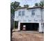 Exterior view of a house under construction, covered with Tyvek wrap and showing window openings at 6968 Doddridge Ln # 11, Cary, NC 27519