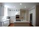 Bright kitchen featuring white cabinets, stainless steel appliances, and island with a gas cooktop at 704 Walcott Way, Cary, NC 27519