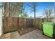 Fenced backyard patio featuring a wooded backdrop providing shade and a sense of privacy at 7205 Sandy Creek Dr, Raleigh, NC 27615