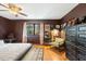 Comfortable bedroom with rich brown walls, a cozy bed, and natural light from the window at 7205 Sandy Creek Dr, Raleigh, NC 27615