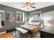 Comfortable bedroom with neutral tones, natural light, and modern decor at 7205 Sandy Creek Dr, Raleigh, NC 27615