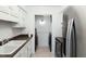 Well-lit laundry area with modern appliances and ample storage at 7205 Sandy Creek Dr, Raleigh, NC 27615