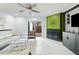 Bright living room featuring a modern fireplace and glass sliding doors to the backyard at 7205 Sandy Creek Dr, Raleigh, NC 27615