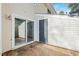 Cozy back patio featuring a sliding glass door and an outdoor storage closet for convenience at 7205 Sandy Creek Dr, Raleigh, NC 27615