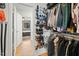 Organized walk-in closet with ample storage for clothes, shoes, and accessories at 7205 Sandy Creek Dr, Raleigh, NC 27615