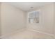 Simple bedroom with neutral colors, one window, and a ceiling fan at 7213 Terregles Dr, Raleigh, NC 27617