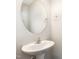 Elegant half bathroom featuring a pedestal sink and modern fixtures at 7213 Terregles Dr, Raleigh, NC 27617