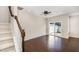 Cozy living area with staircase, hardwood floors, and bright sliding glass door at 7213 Terregles Dr, Raleigh, NC 27617