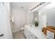 Bathroom featuring a large mirror over a vanity with a sink, tiled floor, and white shower curtain at 7753 Winners Edge St, Raleigh, NC 27617