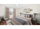 Cozy bedroom features natural lighting and stylish decor, including a comfortable bed and a window at 7753 Winners Edge St, Raleigh, NC 27617