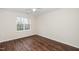Bedroom boasts hardwood floors and large windows, offering natural light at 7753 Winners Edge St, Raleigh, NC 27617
