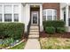 Inviting home entrance with well-maintained landscaping and a welcoming walkway to the front door at 7753 Winners Edge St, Raleigh, NC 27617