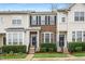 Charming townhomes featuring well-maintained lawns, brick facades, and updated exterior paint colors at 7753 Winners Edge St, Raleigh, NC 27617