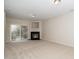 Spacious living room with a fireplace and sliding doors to the outside at 7753 Winners Edge St, Raleigh, NC 27617