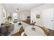 Bright living room features a stylish rug, contemporary furnishings, and ample natural light at 7753 Winners Edge St, Raleigh, NC 27617