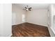 Spacious main bedroom with hardwood floors, a ceiling fan, and a view to the ensuite at 7753 Winners Edge St, Raleigh, NC 27617