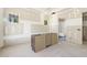 Bathroom features cabinetry, with windows and adjacent shower area awaiting fixtures at 9000 Penny Rd, Raleigh, NC 27606