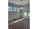 Bright dining area offers ample natural light with large windows and a modern light fixture at 9000 Penny Rd, Raleigh, NC 27606